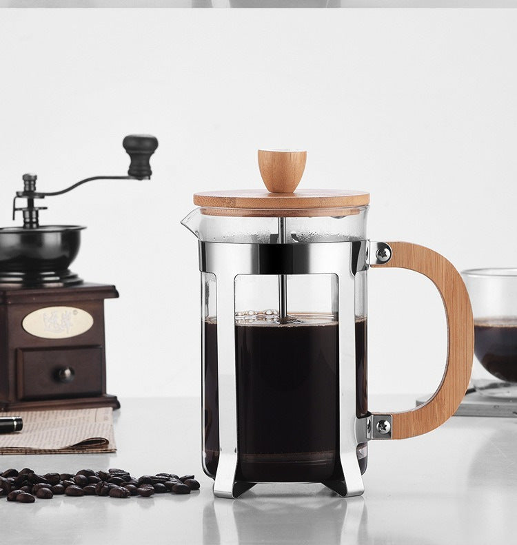 Stylish French press with bamboo accents for fresh, easy coffee brewing.