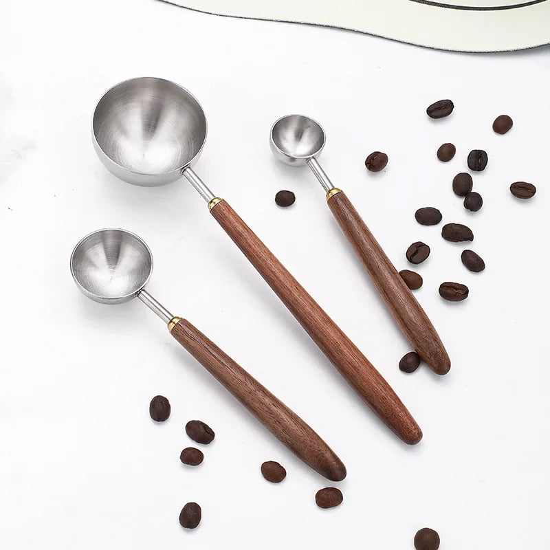 Elegant and practical coffee scoop with a durable wooden handle for precise measuring.