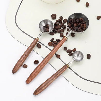 Elegant and practical coffee scoop with a durable wooden handle for precise measuring.